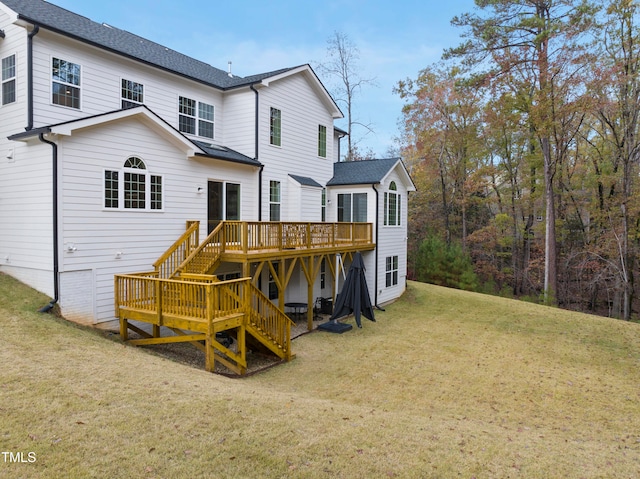 back of house with a lawn and a wooden deck