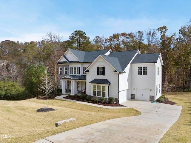 view of front of house featuring a front yard and a garage