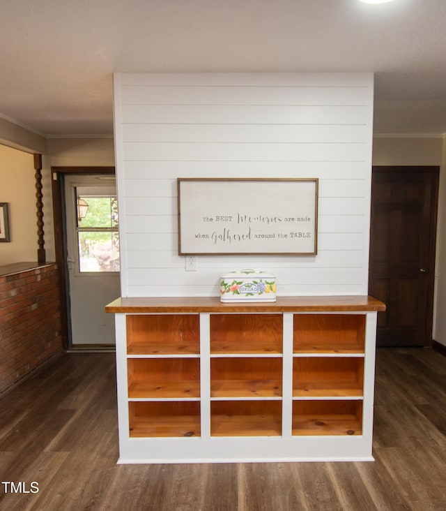 interior details featuring hardwood / wood-style flooring and wooden walls