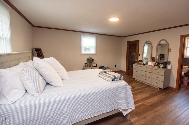 bedroom featuring dark hardwood / wood-style floors and ornamental molding