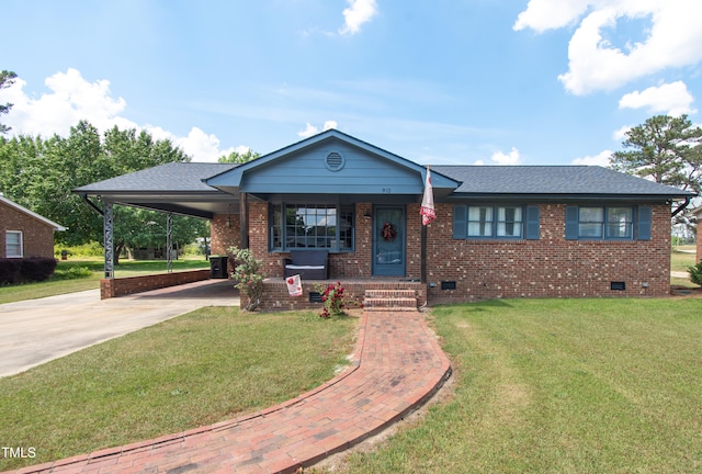 view of front of home with a front lawn and a carport