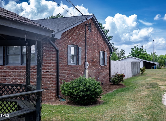 view of home's exterior with a yard