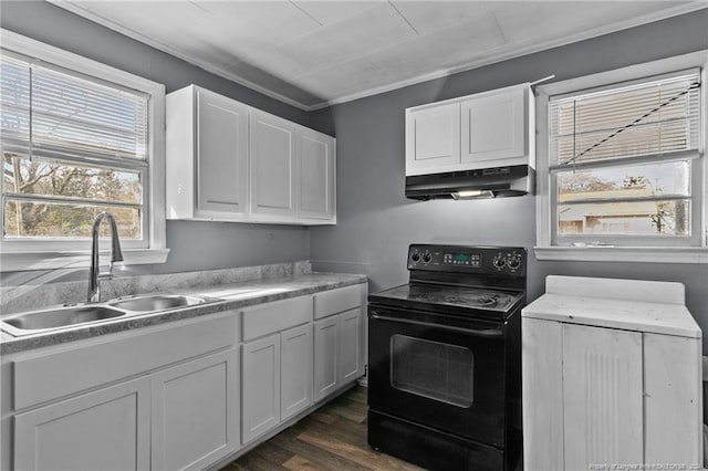 kitchen with dark hardwood / wood-style flooring, white cabinetry, black electric range oven, and ornamental molding