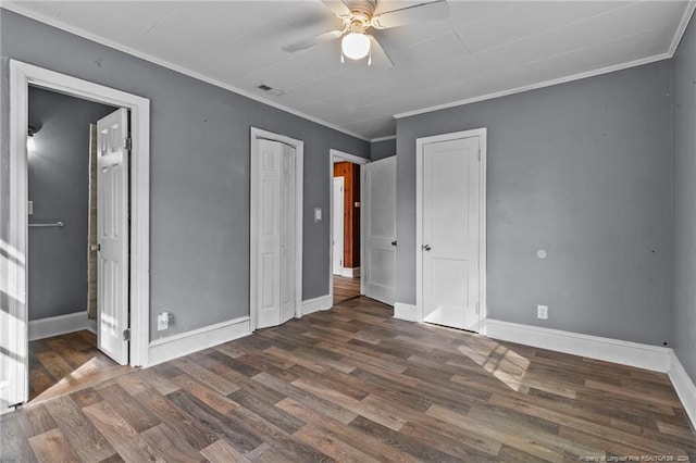 unfurnished bedroom featuring ceiling fan, dark hardwood / wood-style flooring, and ornamental molding