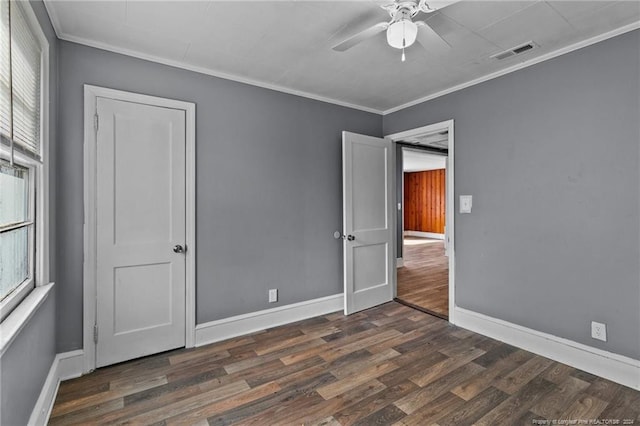 spare room with ceiling fan, crown molding, and dark hardwood / wood-style flooring