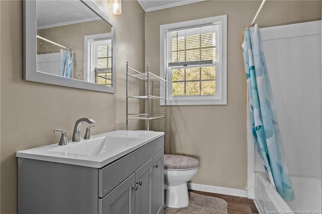 full bathroom with ornamental molding, shower / tub combo with curtain, wood-type flooring, vanity, and toilet