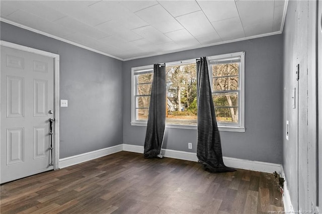 entrance foyer featuring dark wood-type flooring and crown molding