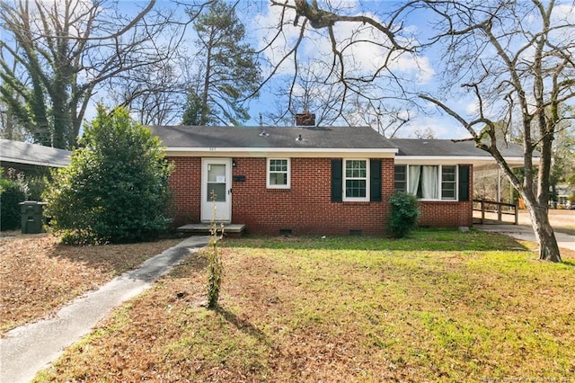 ranch-style house with a front lawn and a carport