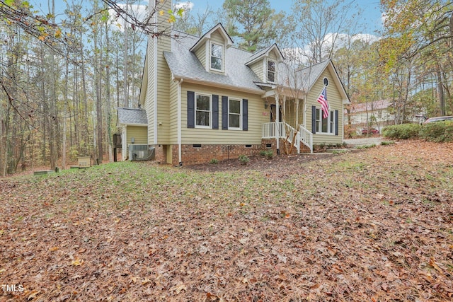 cape cod house featuring central AC