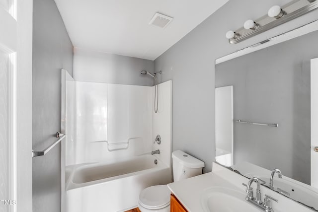 full bathroom featuring vanity, shower / bathtub combination, and toilet