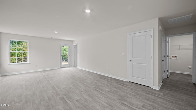 unfurnished room featuring light hardwood / wood-style floors