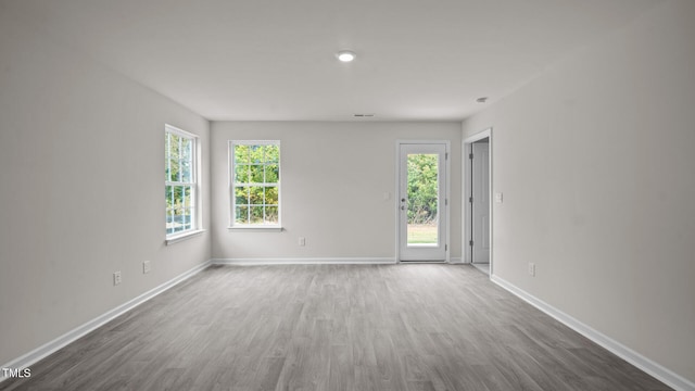 empty room featuring wood-type flooring