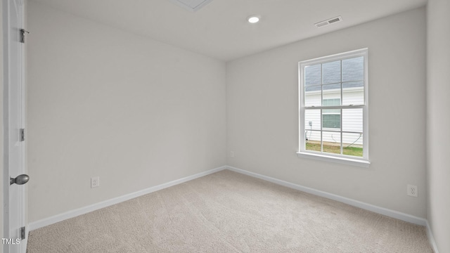 carpeted spare room with a healthy amount of sunlight