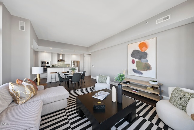 living room featuring dark hardwood / wood-style flooring