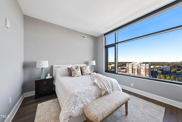 bedroom featuring dark hardwood / wood-style flooring