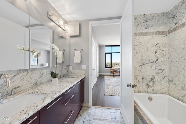 bathroom with hardwood / wood-style floors and vanity