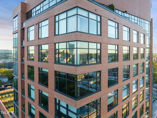 view of outdoor building at dusk