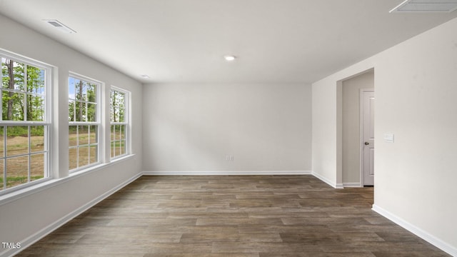 236 Holton St, Smithfield, NC 27577 - spare room featuring baseboards, wood finished floors, and recessed lighting
