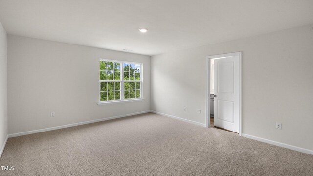 236 Holton St, Smithfield, NC 27577 - carpeted empty room with baseboards