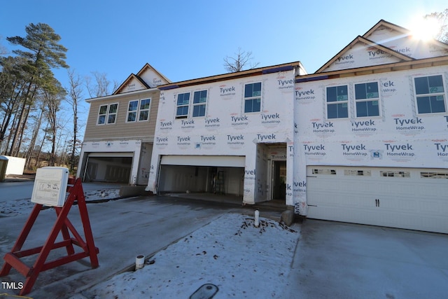 property in mid-construction featuring a garage