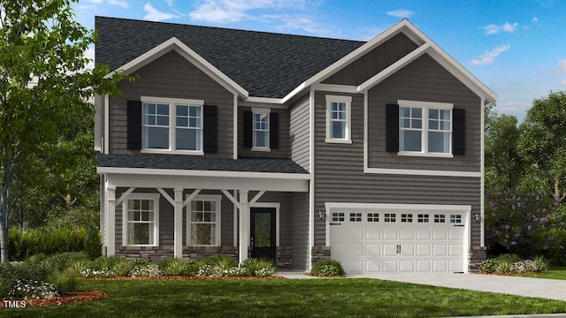 craftsman house featuring a garage and a front lawn