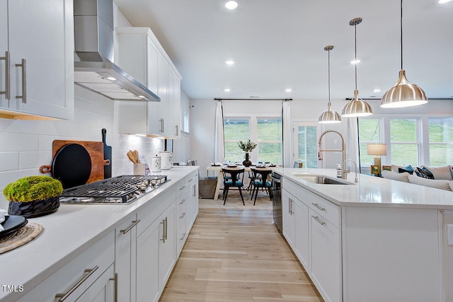 904 Delano Dr, Knightdale, NC 27545 - kitchen featuring a sink, wall chimney exhaust hood, plenty of natural light, light wood-type flooring, and recessed lighting