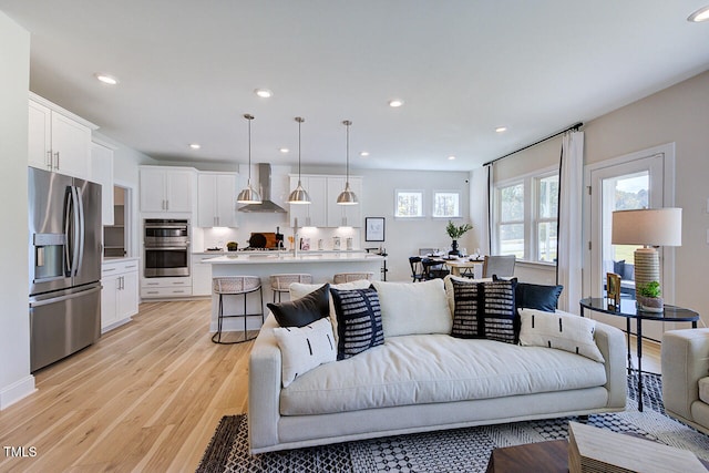 living room with light hardwood / wood-style floors