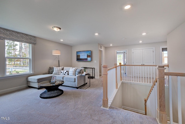 living room featuring light carpet