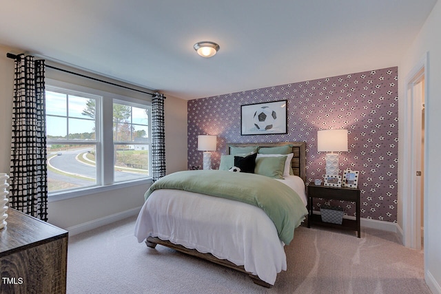 904 Delano Dr, Knightdale, NC 27545 - carpeted bedroom with baseboards, wallpapered walls, and an accent wall