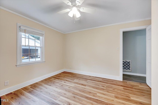 unfurnished room with light hardwood / wood-style floors, ceiling fan, and ornamental molding