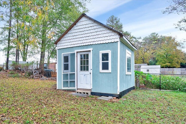 view of outbuilding with a lawn