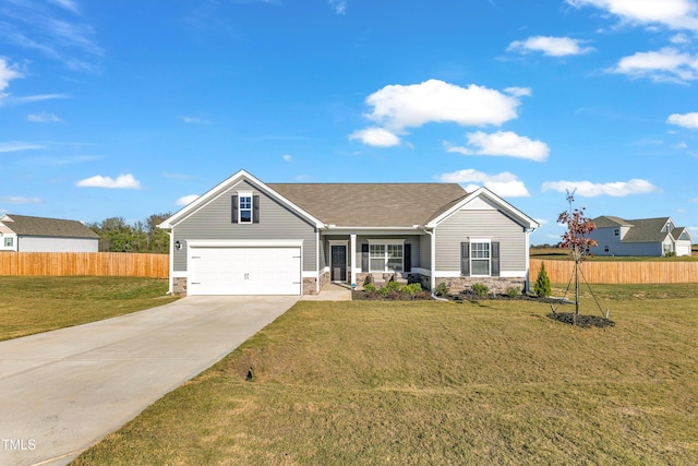 view of front of home with a front lawn and a garage