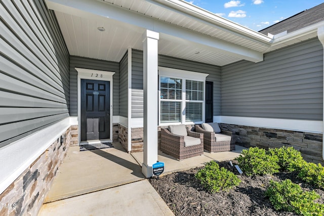 doorway to property featuring covered porch