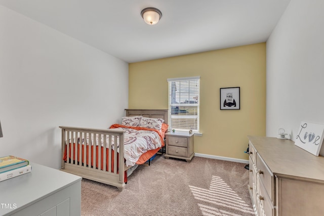 bedroom featuring light carpet