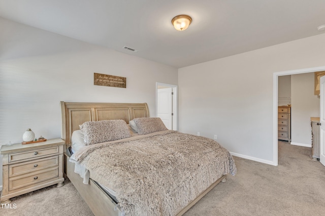 bedroom featuring light colored carpet