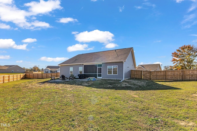 back of property featuring a patio area and a lawn