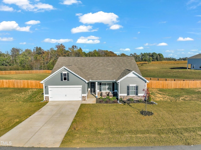 ranch-style house featuring a porch, a garage, and a front lawn