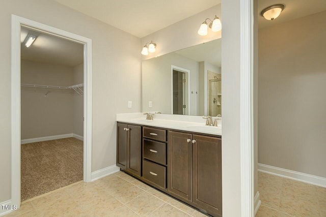 bathroom with tile patterned flooring and vanity