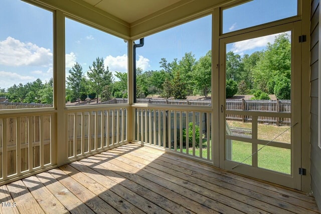 unfurnished sunroom featuring plenty of natural light