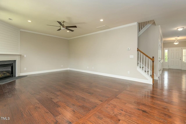 unfurnished living room featuring crown molding, ceiling fan, and dark wood-type flooring