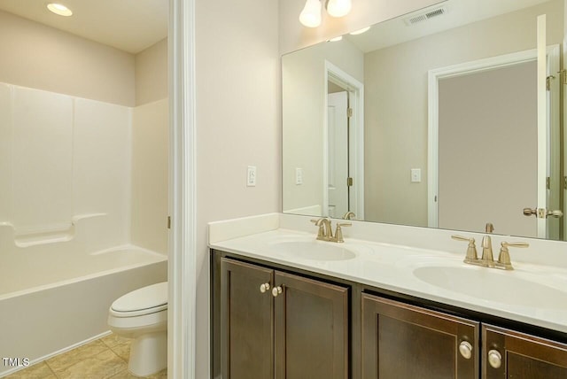 full bathroom with bathtub / shower combination, tile patterned floors, vanity, and toilet