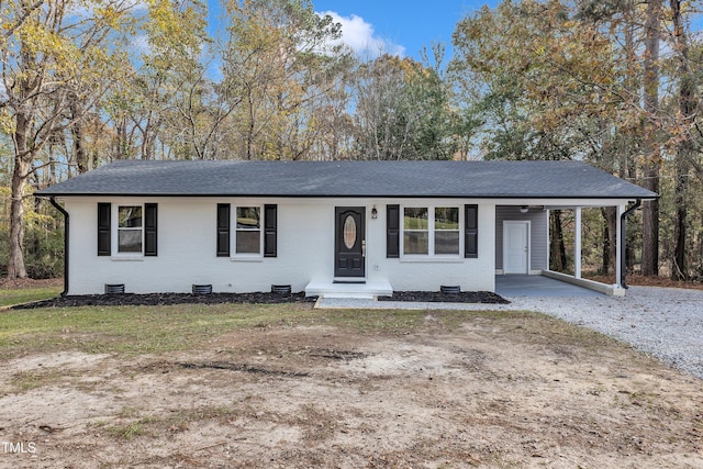 single story home featuring a carport