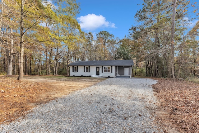 1518 Parks Village Rd, Zebulon, NC 27597 - ranch-style home with gravel driveway and a shingled roof