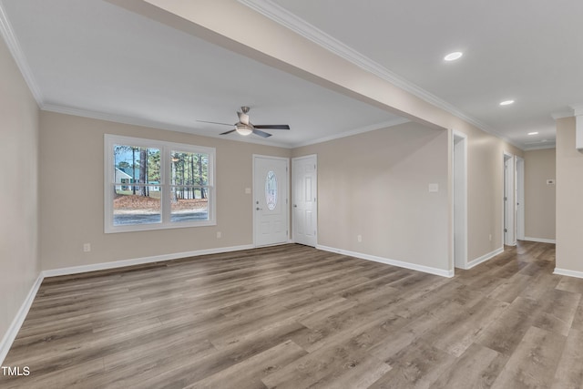1518 Parks Village Rd, Zebulon, NC 27597 - unfurnished living room with crown molding, ceiling fan, and light wood-type flooring