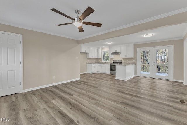1518 Parks Village Rd, Zebulon, NC 27597 - unfurnished living room featuring french doors, light wood-style flooring, crown molding, a ceiling fan, and baseboards