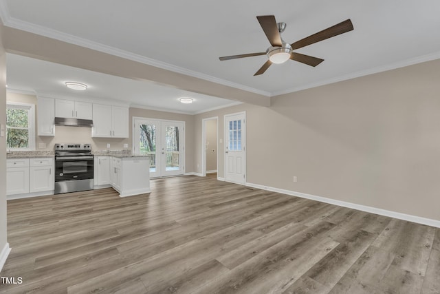 1518 Parks Village Rd, Zebulon, NC 27597 - kitchen with white cabinetry, plenty of natural light, stainless steel range with electric cooktop, and light wood-type flooring