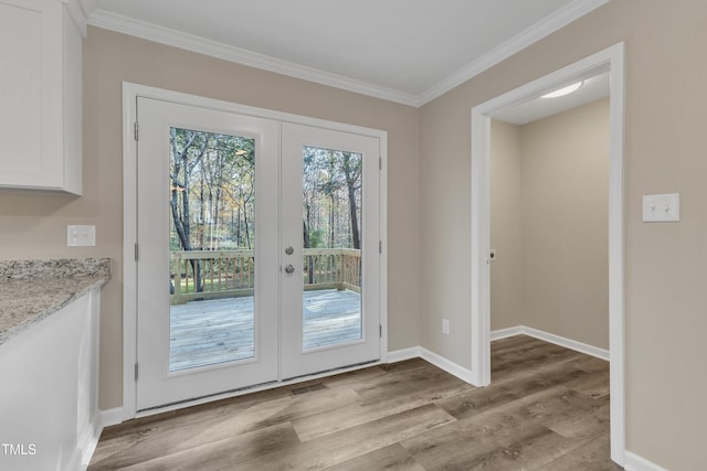 1518 Parks Village Rd, Zebulon, NC 27597 - doorway to outside featuring french doors, light hardwood / wood-style flooring, and crown molding