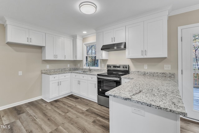 1518 Parks Village Rd, Zebulon, NC 27597 - kitchen featuring stainless steel range with electric cooktop, under cabinet range hood, a sink, crown molding, and white cabinetry