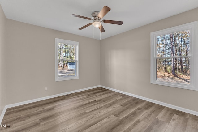 1518 Parks Village Rd, Zebulon, NC 27597 - empty room featuring ceiling fan, wood finished floors, and baseboards