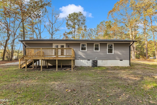 1518 Parks Village Rd, Zebulon, NC 27597 - back of house with central air condition unit, a wooden deck, and a yard